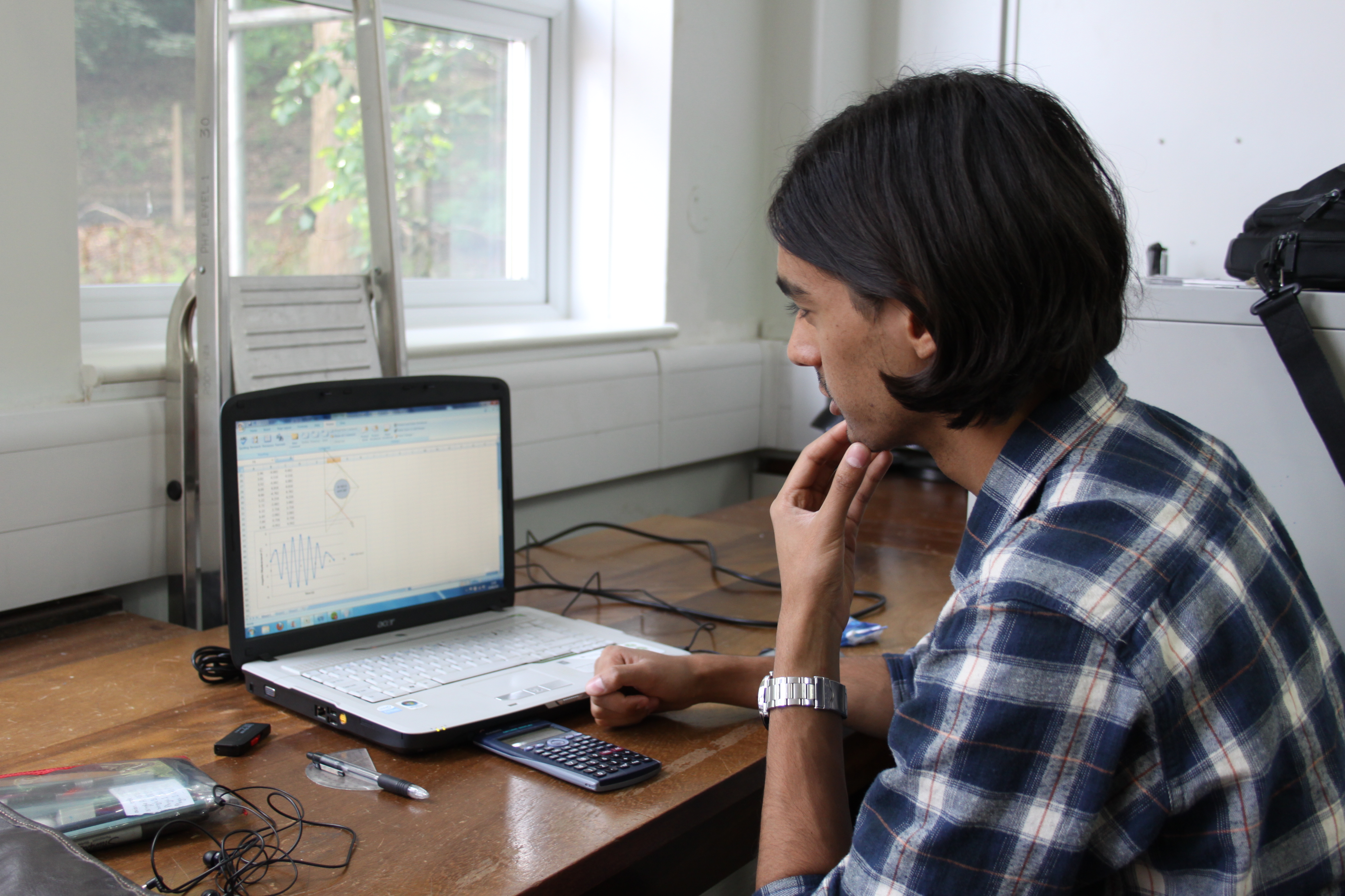 Male undergraduate student on laptop