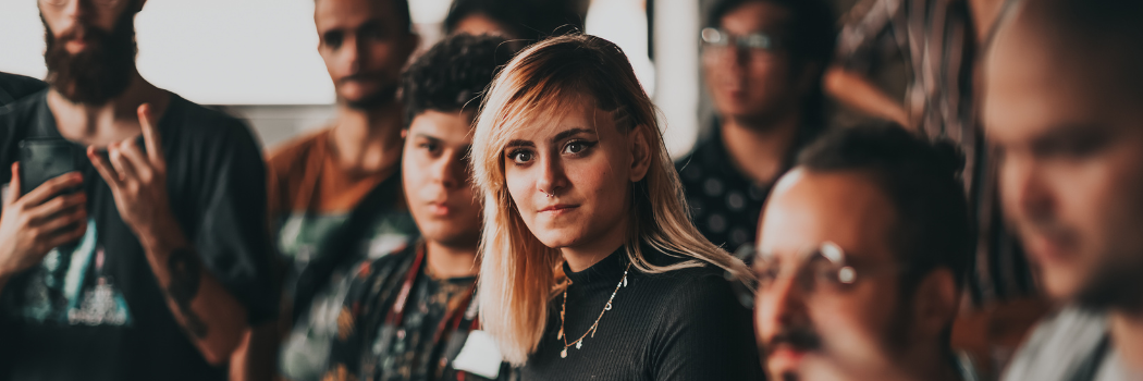 A group of people in a meeting room.