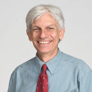 A man smiling with a white background