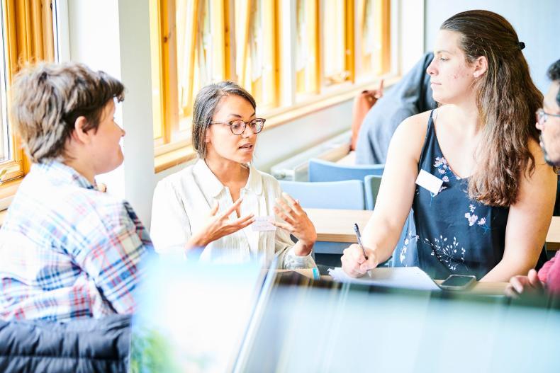 Four students having a group discussion