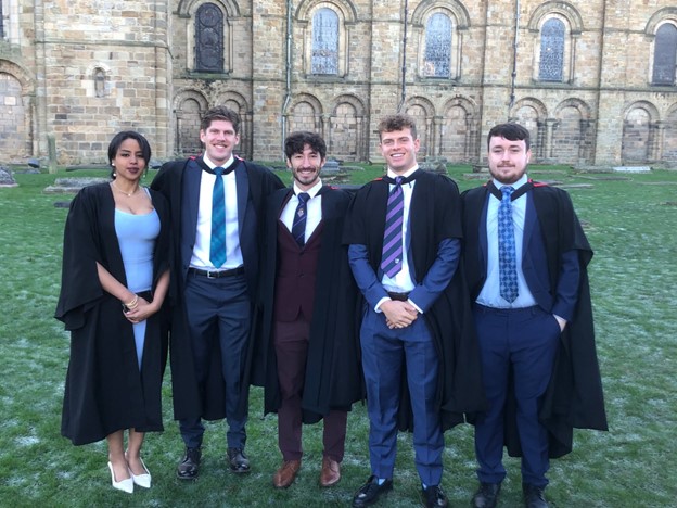 A group of students posing for a photo at Winter graduation