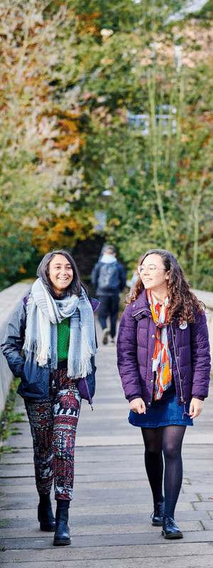 Students walking across Prebends Bridge