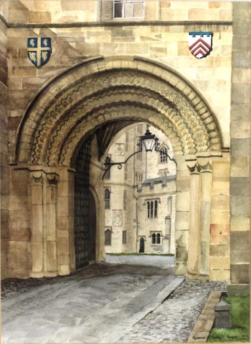 An archway in a stone building leading into a courtyard