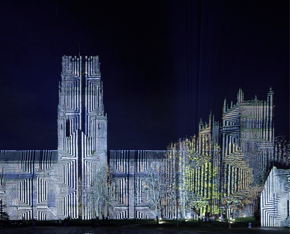 Durham cathedral illuminated in black and white geometrical shapes