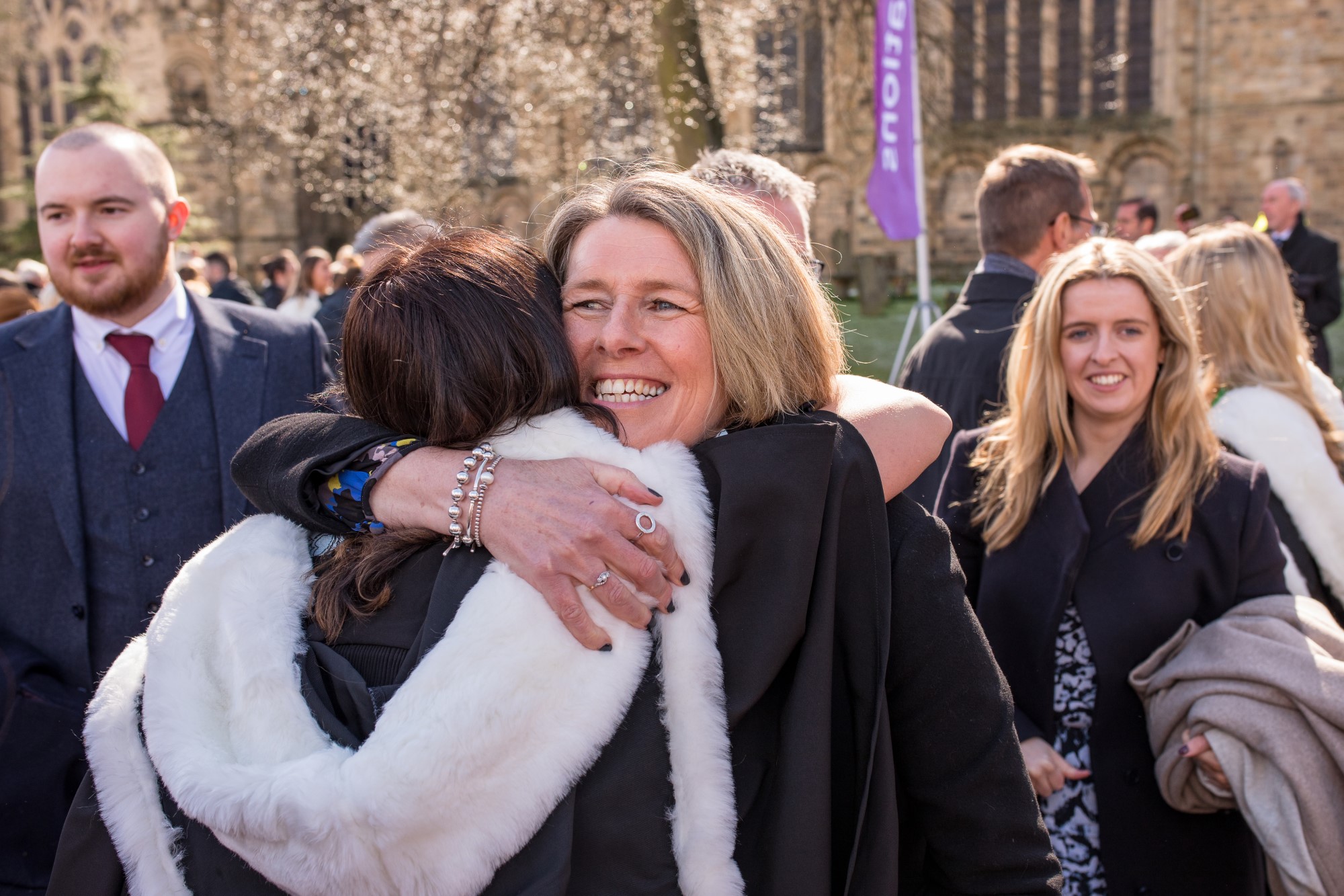 Parent hugging student during Congregation