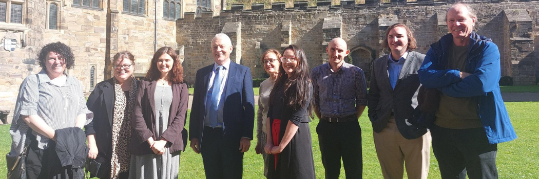 Group of staff and students with High Commissioner