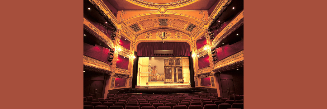 The inside of a theatre with a stage set for an opera performance