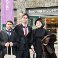 Graduates and Guest outside the Teaching and Learning Centre.