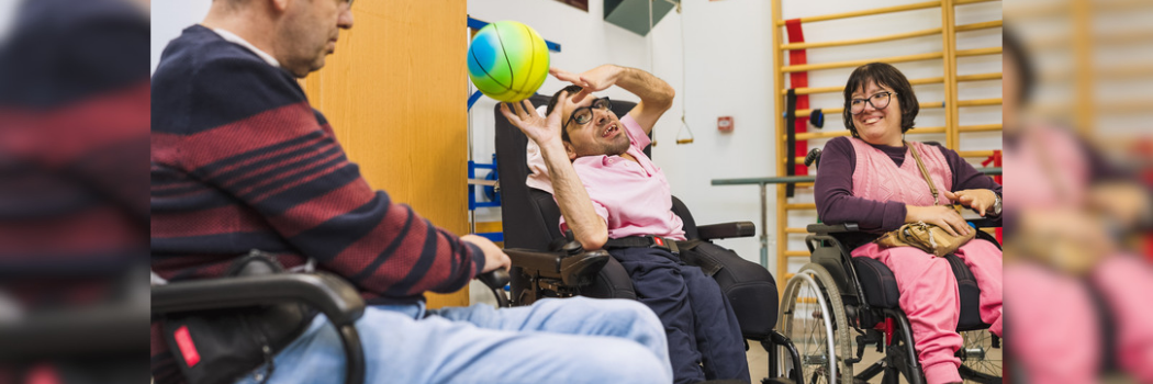 Disabled person exercising with a ball