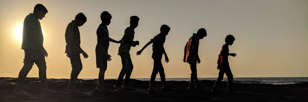 Silhouettes of a child growing through to an adult