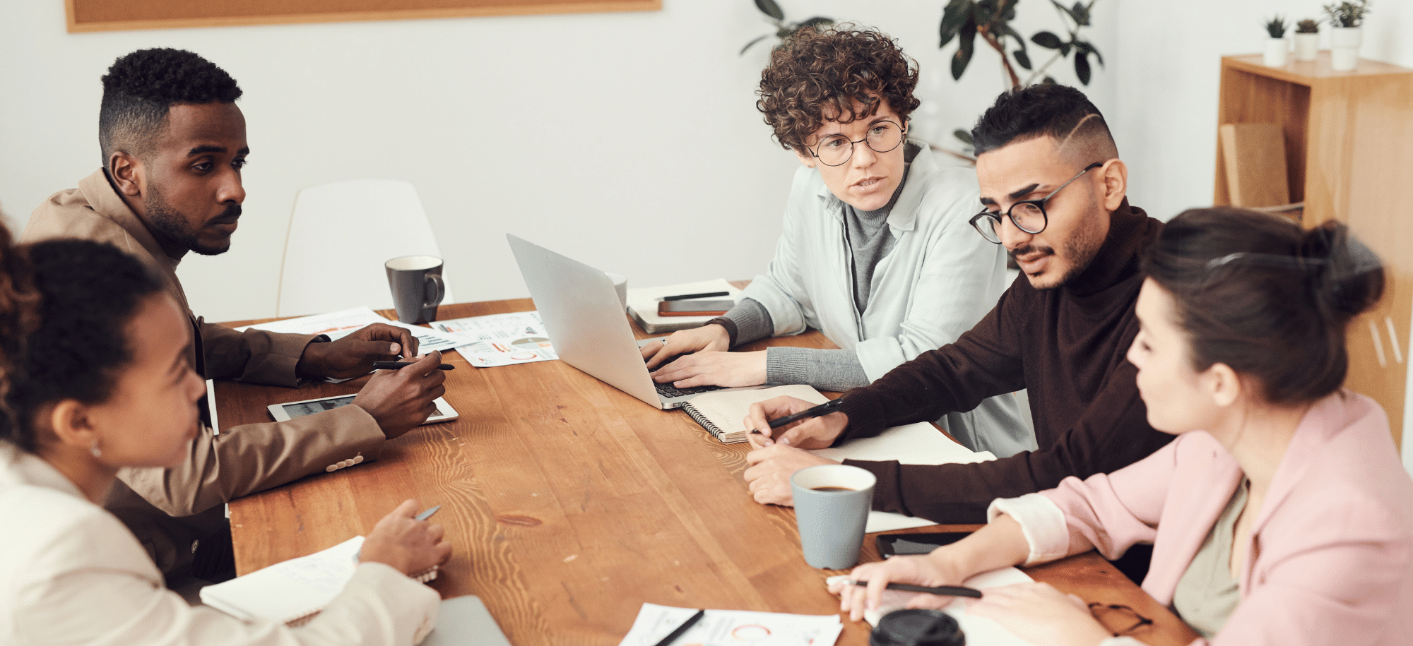 A group of people in an office.