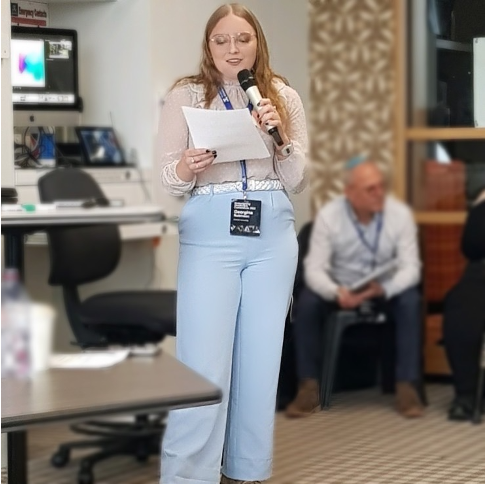 Female student presenting a paper