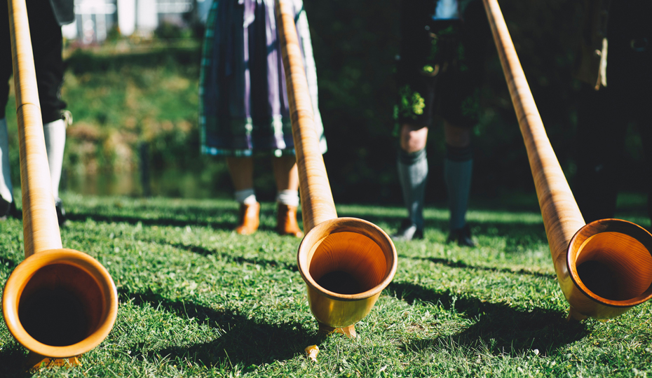 People playing Alpine horns