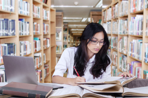 Female student studying in library