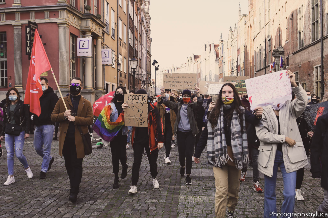 People handling placards and protesting in the street