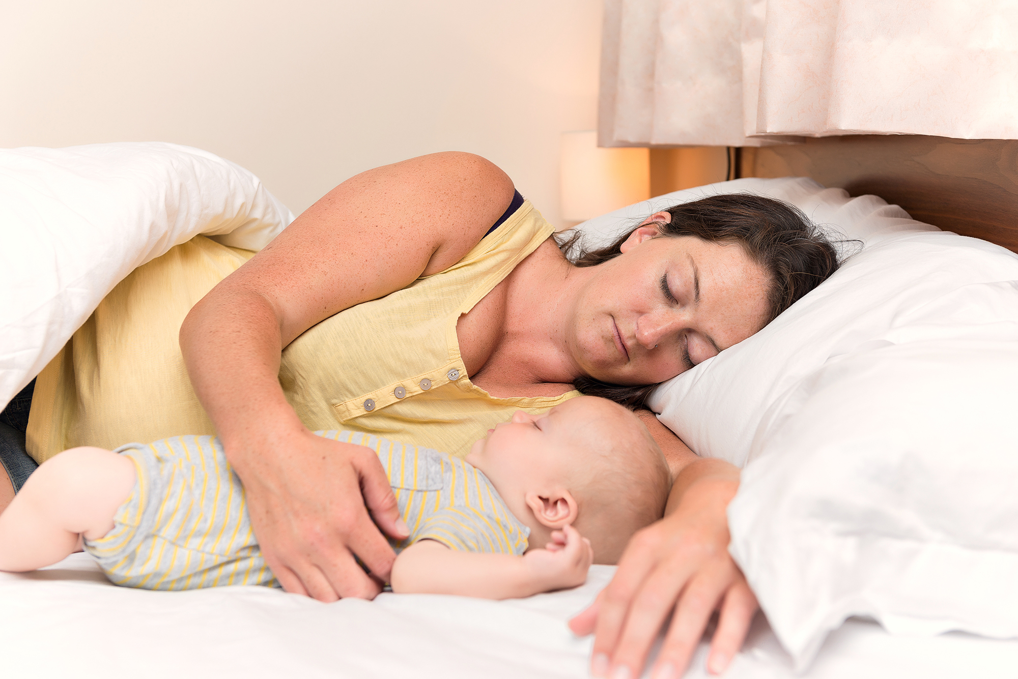 Woman laying down with baby