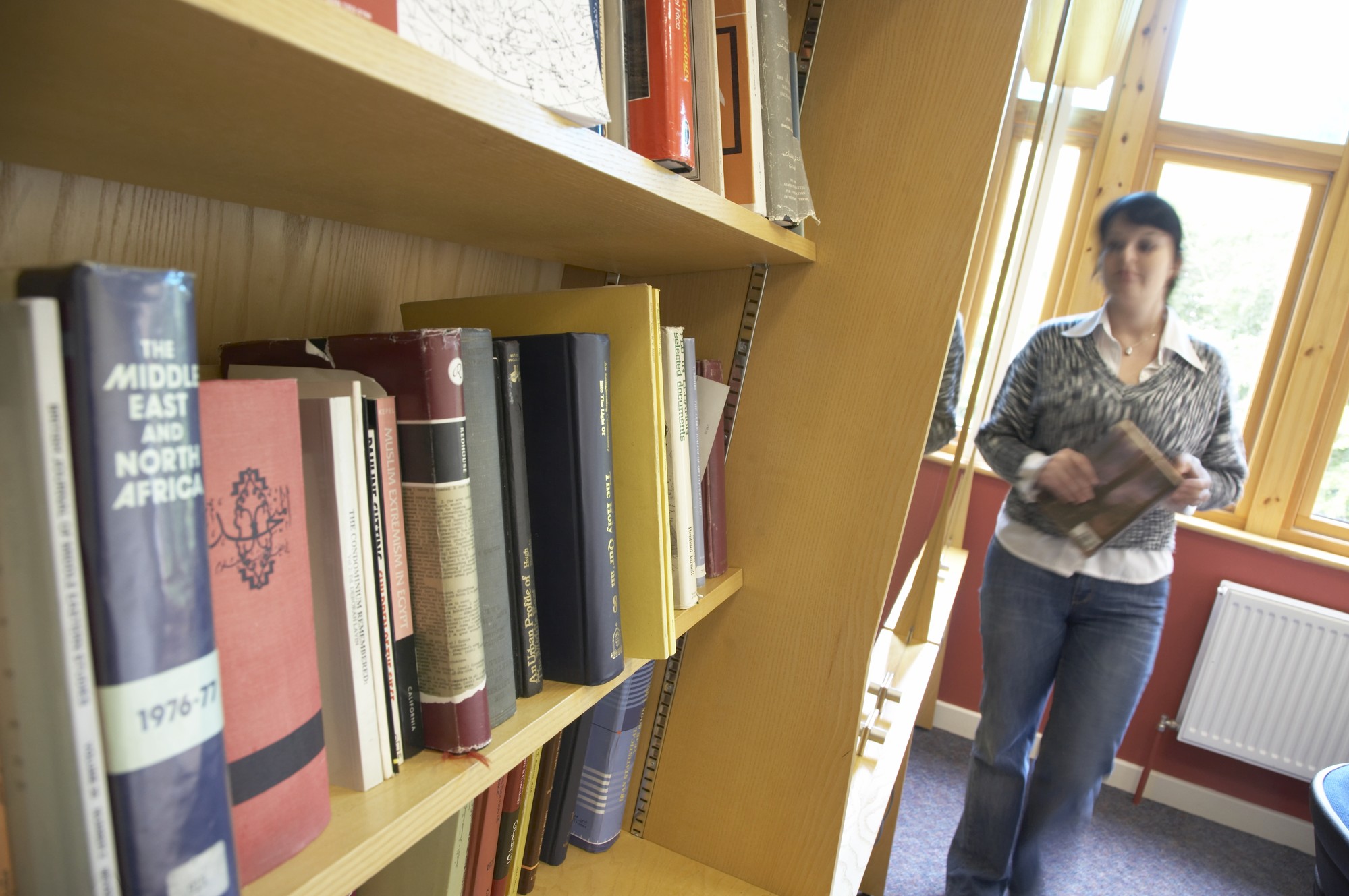 Student walking in library