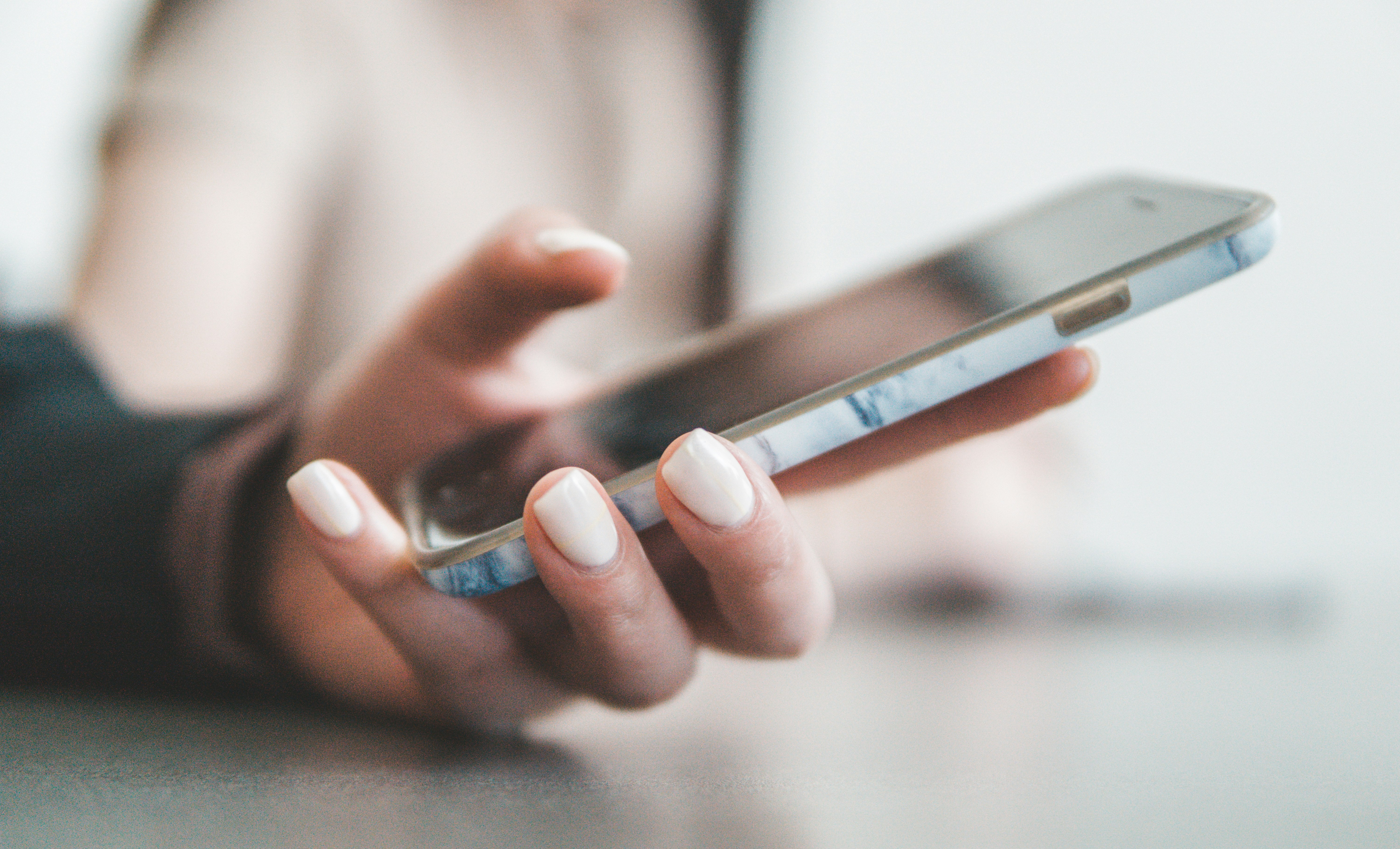 A mobile phone being held