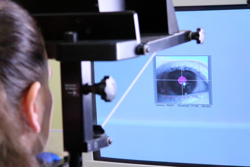 A Psychology technician calibrating an eyetracker