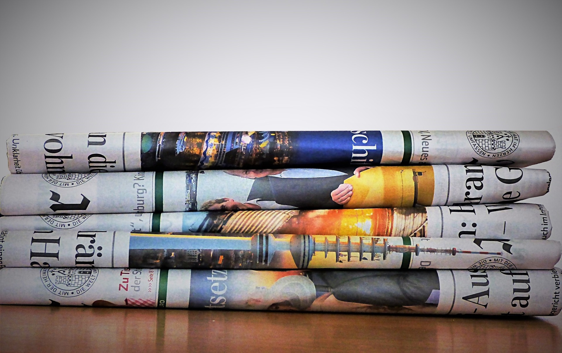 A pile of newspapers stacked on top of each other