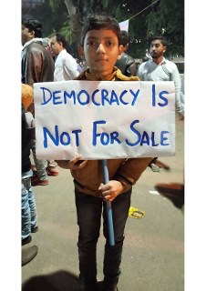 Child holding a poster.