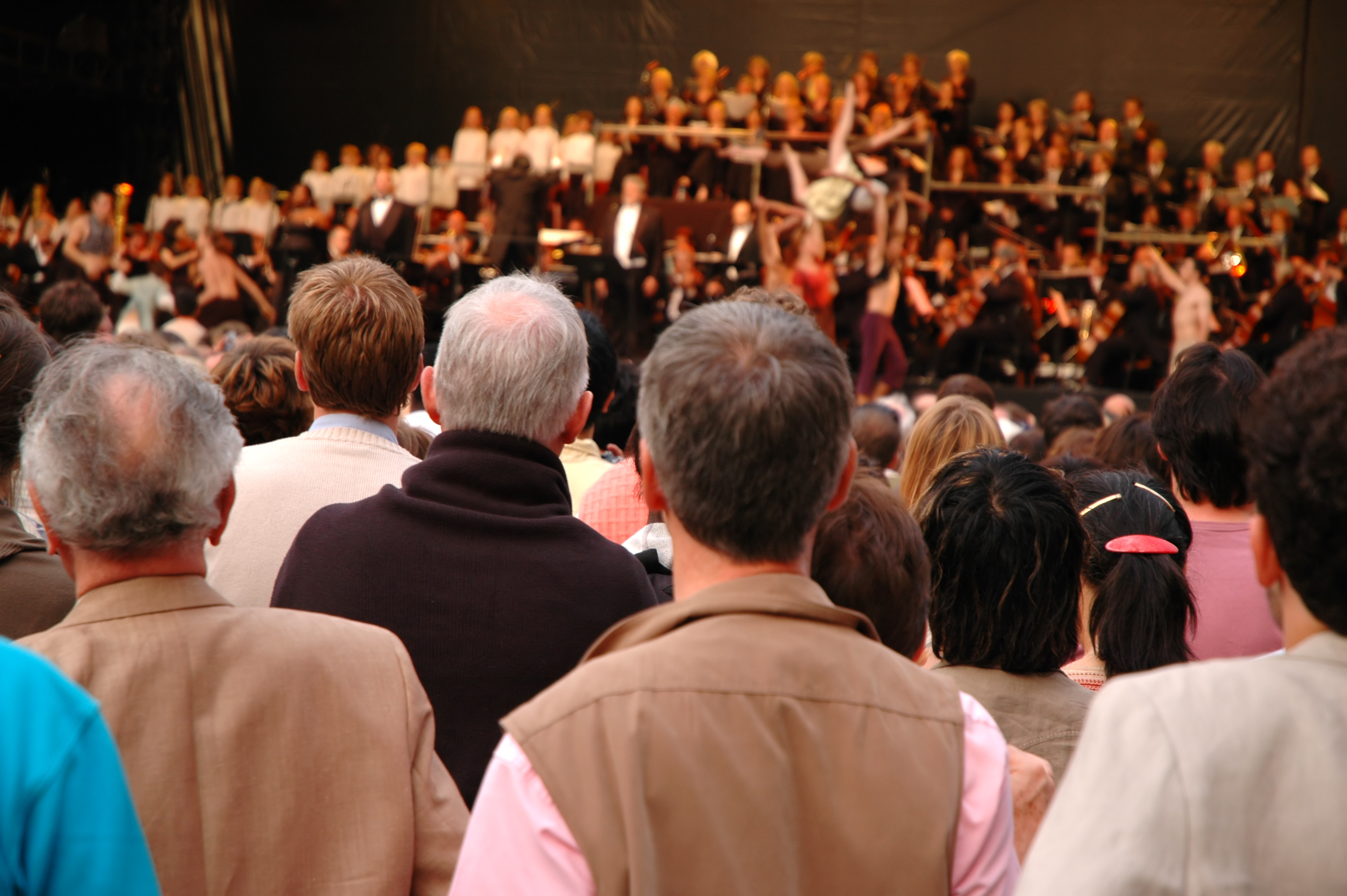 people watching an orchestra