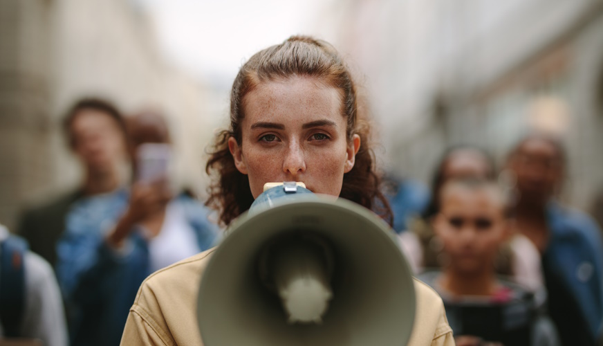 Women with megaphone image courtesy of iStock