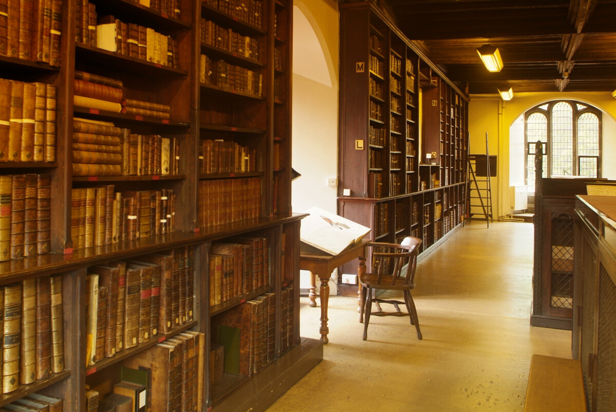 A historic library with shelves full of old books