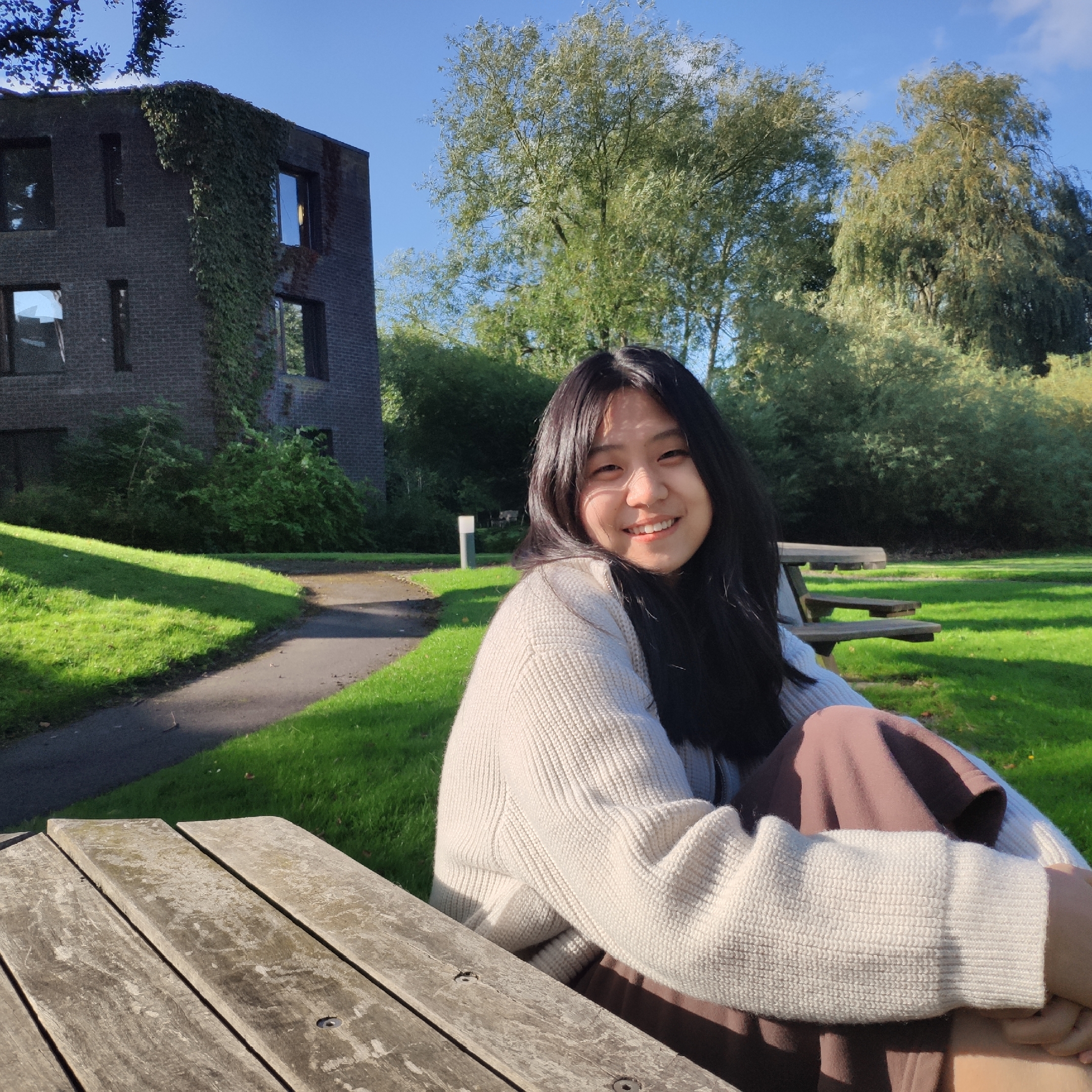 Yuru sitting on a park bench