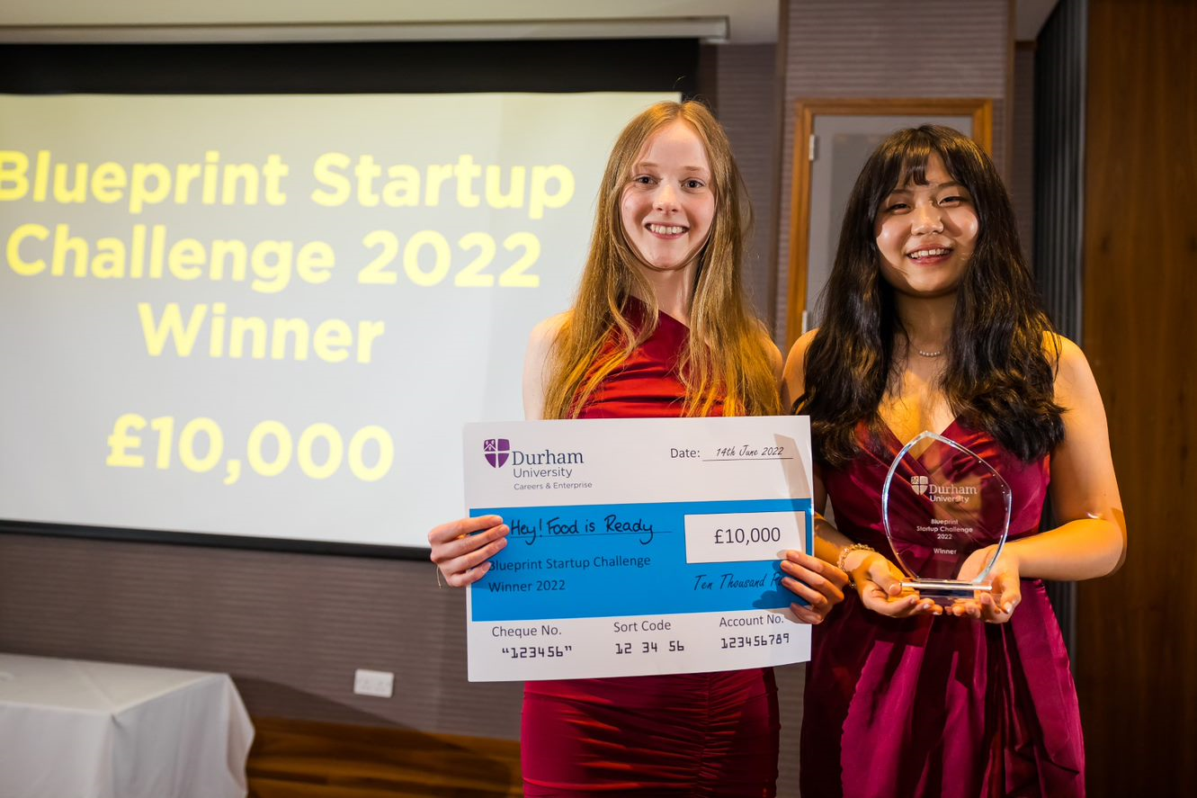 Blueprint winners holding a prize cheque