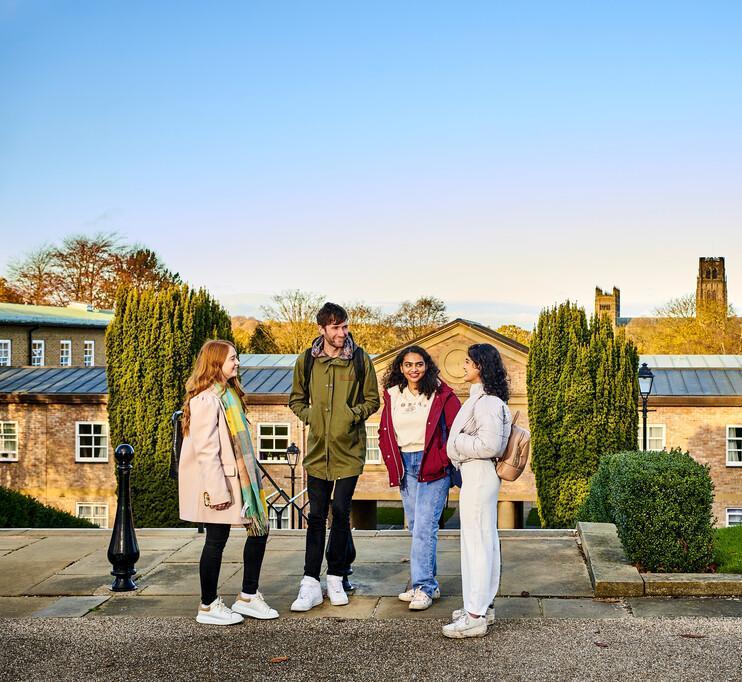 students standing outside on campus