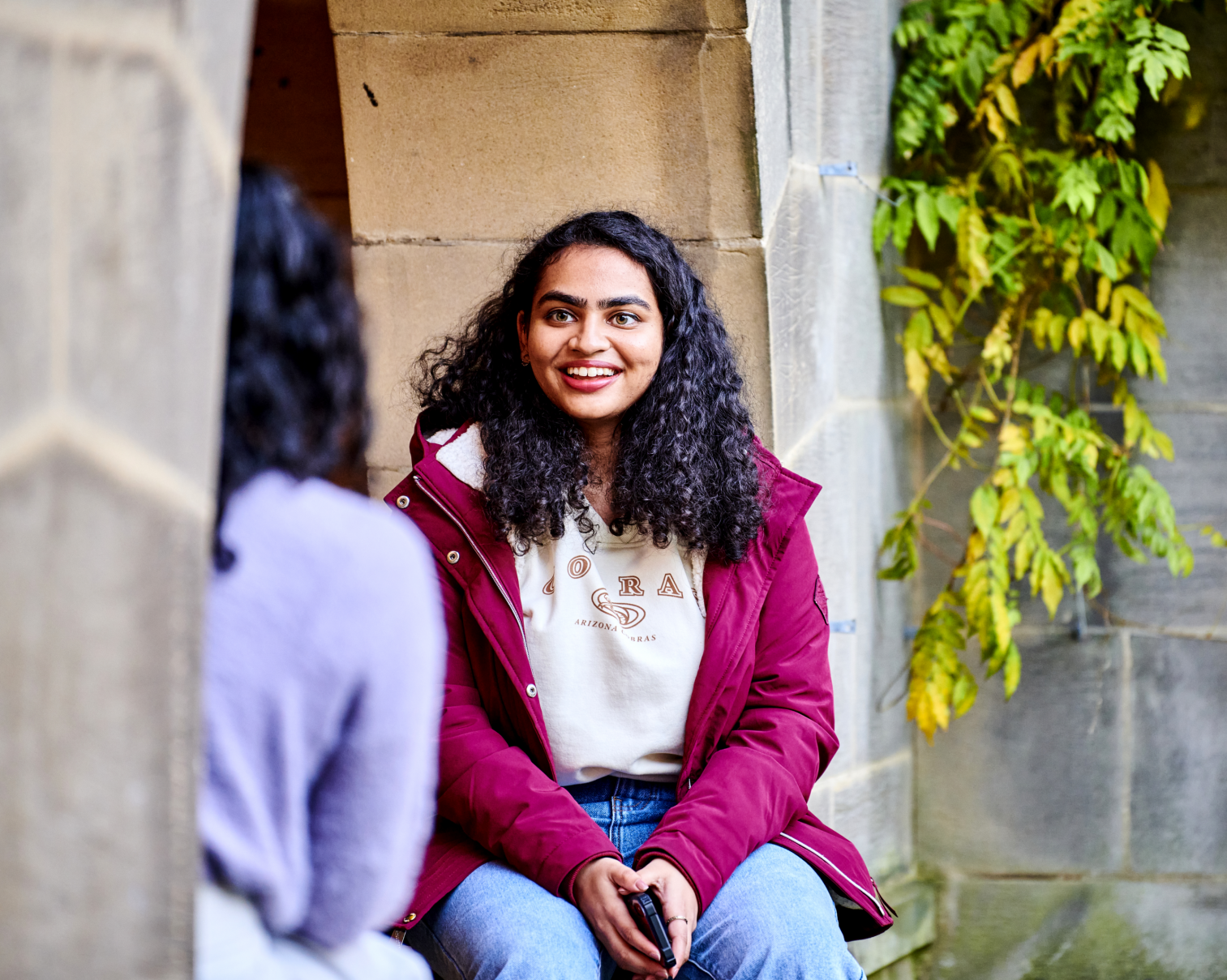 Student sitting on wall at St Mary's College