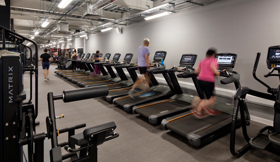 The interior of the Fitness Centre with people using various gym equipment