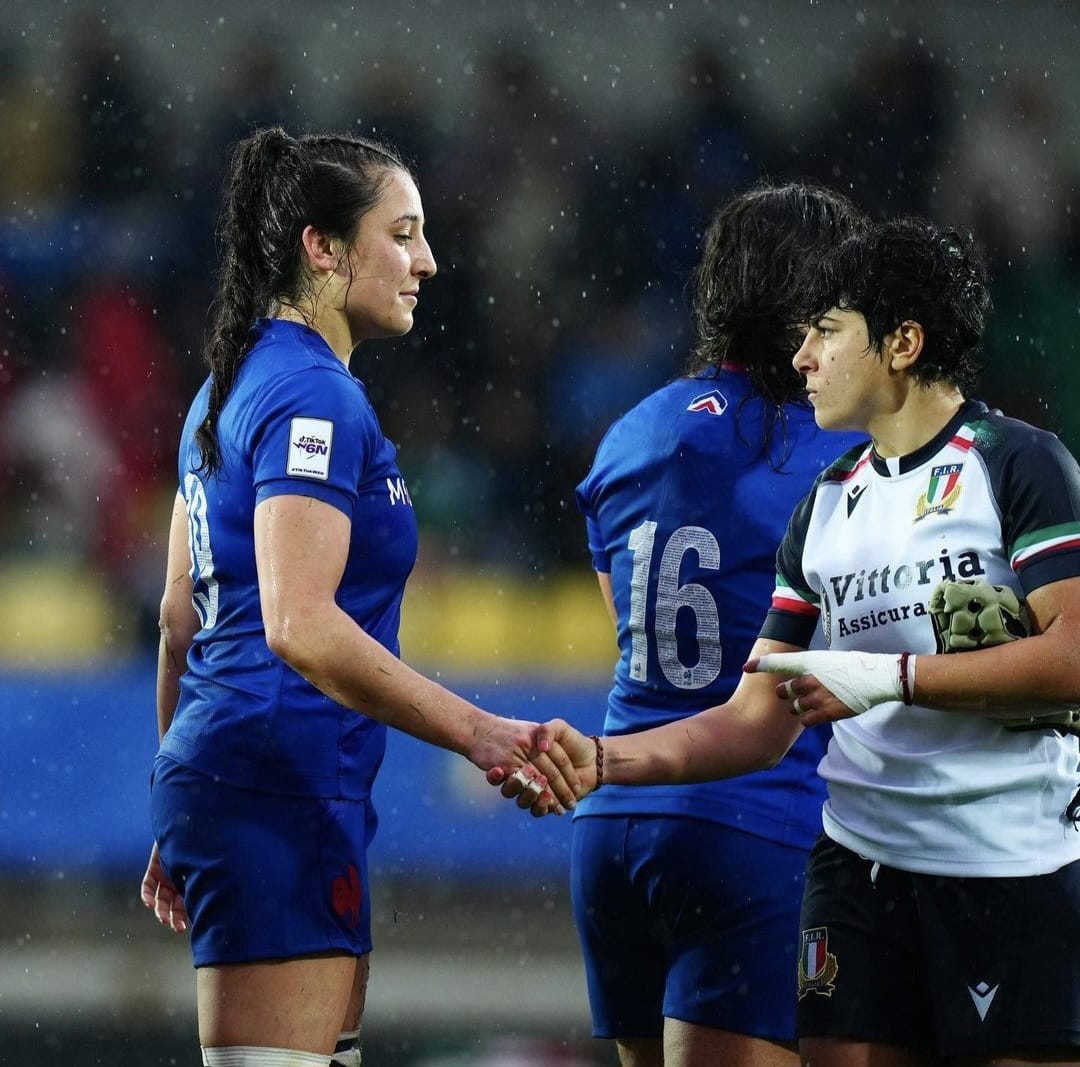 Woman shaking hands in match