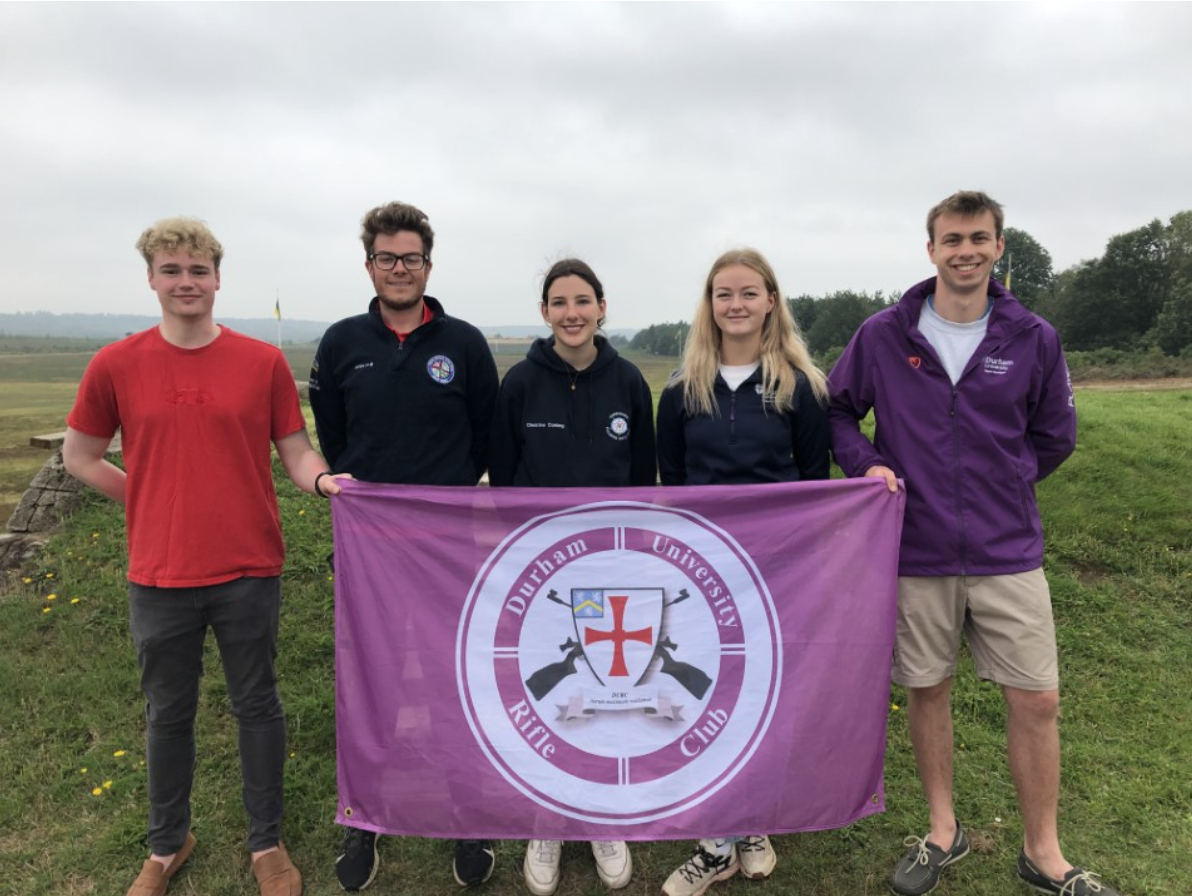 Rifles team photo with flag