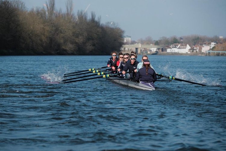 Women rowing in a boat