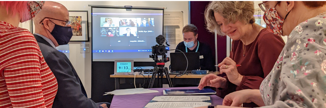 A group of people participating in a virtual meeting.