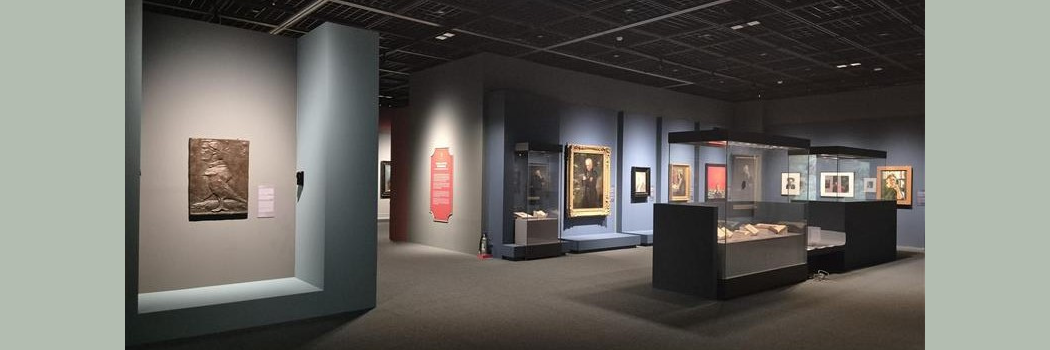 A gallery with portraits and lighting