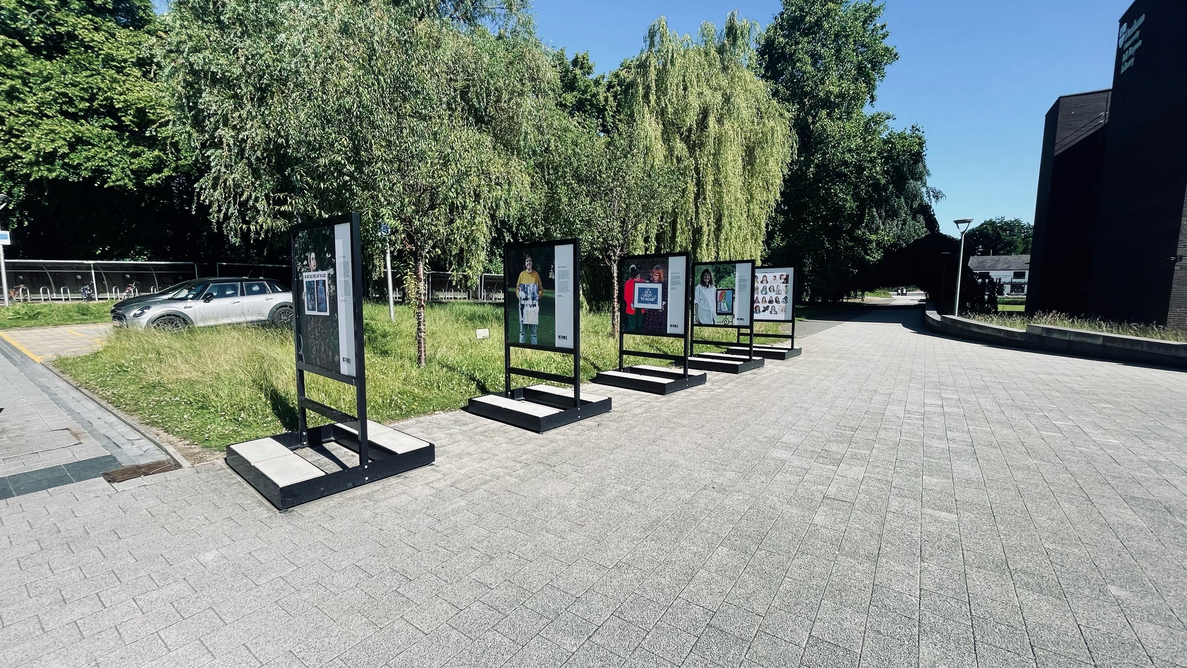 Image of outdoor gallery boards in a row