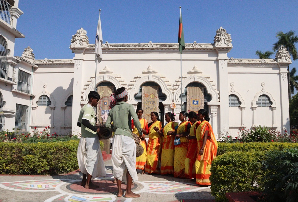 People standing in front of a large buildling
